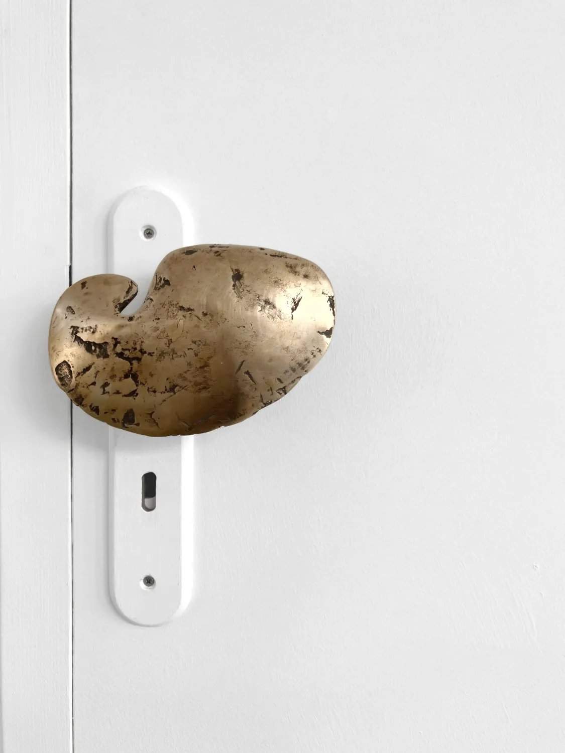 Bronze cast door handle sculpture