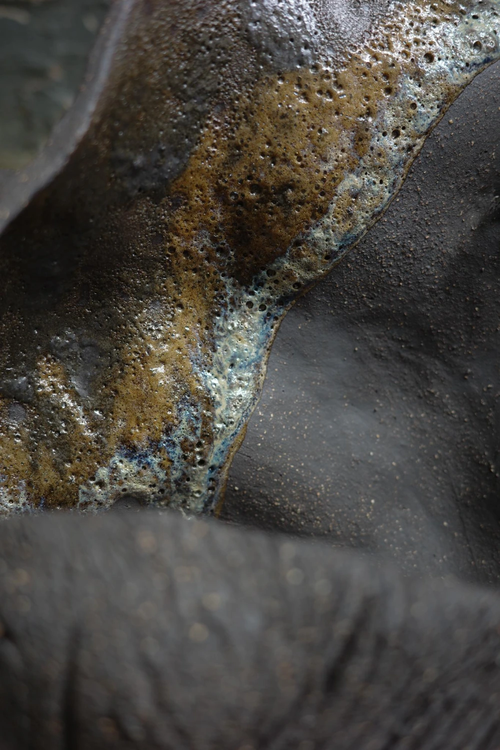 Close-up of dark metallic glaze ceramic texture