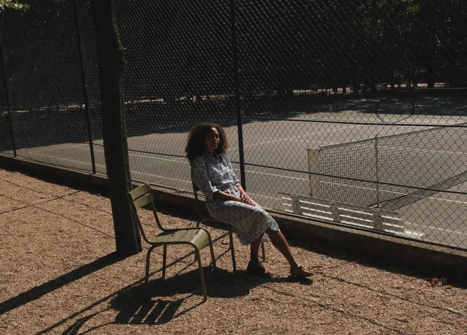 Yvan Canal Street 55 Woman Sitting Outdoors Sunlight - Canal Street 55 | Repose Archive